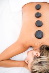 Woman getting a massage with hot stones